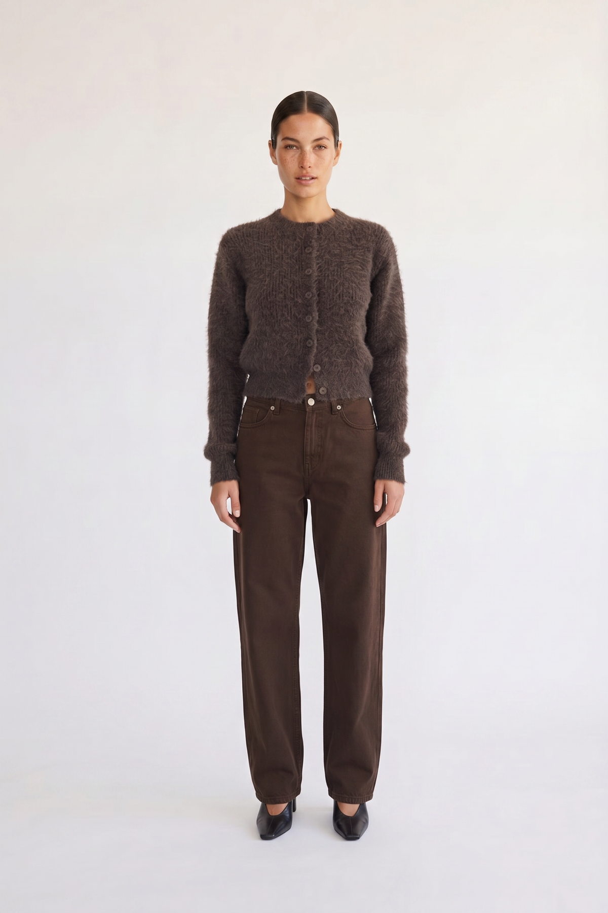 Woman wearing the Noor brown fluffy cropped cardigan, front view
