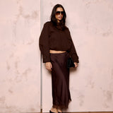 Model styling the Valerie brown satin lace skirt