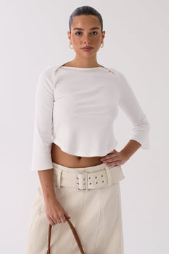 Woman wearing the Lola white top, front view