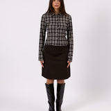 Woman wearing the Margot black check shirt, front view