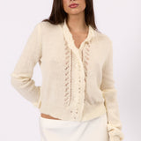 Model styling the Clara white knit cardigan