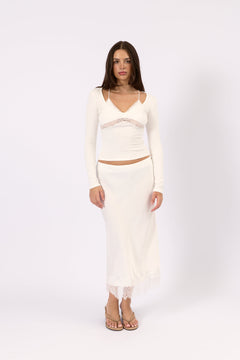 Woman wearing the Valerie white satin lace skirt, front view