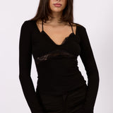 Model styling the Noa black lace long sleeve top