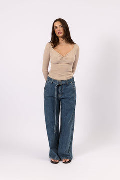 Woman wearing The Twist Top oat twist front top, front view