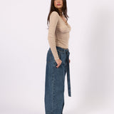 Model styling the Belted Wide Leg Jean blue wide leg jeans